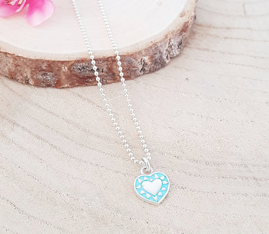 Zilveren ketting met een turquoise/zilver hartje